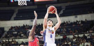TNT Tropang Giga’s Calvin Oftana attempts to score against the defense of Rain or Shine Elasto Painters’ Deon Thompson. PBA PHOTO