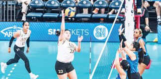 University of Santo Tomas Golden Tigresses’ Bianca Plaza attempts a drop ball against the defense of Ateneo de Manila University Blue Eagles. UAAP PHOTO