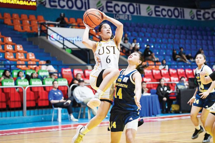 sports_UST_resized Bacolodnon Barby Dajao of University of Santo Tomas Junior Growling Tigresses goes for a layup. UAAP PHOTO