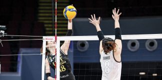 University of Santo Tomas Golden Tigresses’ Regina Jurado avoids the defense of Bacolodnon Joan Marie Monares of the University of the Philippines Fighting Maroons for a drop ball. UAAP PHOTO