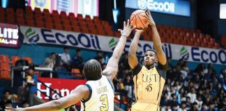 University of Santo Tomas Tiger Cubs' Racine Kane pulls up for a basket. UAAP PHOTO