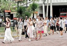 Foreign tourists walk through the walled city of Intramuros on March 10, 2025. According to a report from the Department of Tourism, the Philippines reported total earnings of US$1.1 billion from tourism-related activities, products, and services in January 2025, exceeding pre-pandemic levels. DANNY PATA PHOTO