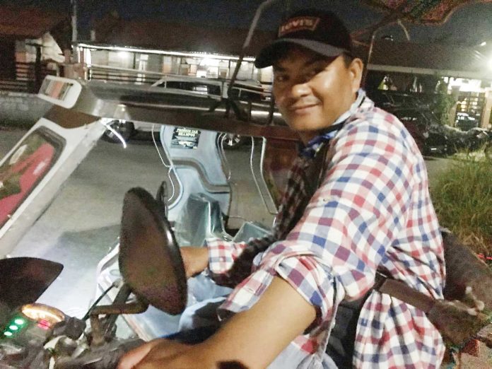 Jeferson, a former overseas Filipino worker, continues journeying through life with three wheels and a smile.