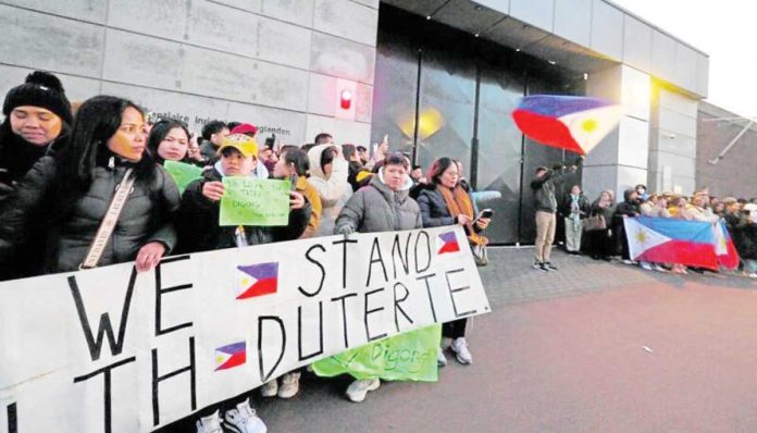 Qatar_1_resized Supporters of former President Rodrigo Duterte gather outside the Scheveningen Prison in The Hague, Netherlands. Their Filipino counterparts in Qatar, on the other hand, were recently arrested and detained, but were eventually released provisionally. REUTERS