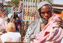 More than 400 killed by rebels in Sudan – UN A woman is pictured holding a baby at ZamZam camp in Sudan. Thousands of people have been forced to flee their homes and have sought aid at refugee camps like ZamZam. REUTERS