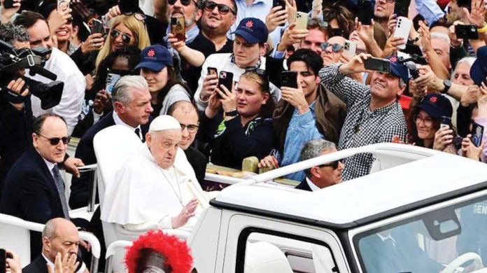 Pope Francis waves to crowds on Easter Sunday during a public appearance which surprised many. GETTY IMAGES