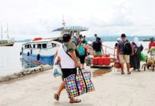 Public warned vs online booking scams amid travel season Passengers gather at Sta. Ana Wharf in Davao City to catch the boat going to Samal Island in Davao del Norte. The Philippine National Police warned the public against tour package scams as the summer travel season peaks. PNA PHOTO BY ROBINSON NIÑAL JR.