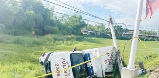 A 44-year-old drug suspect died, and three police officers were injured after this patrol car of the Batad Municipal Police Station hit the gutter and telco post and fell off the road in Barangay Natividad, Barotac Viejo, Iloilo past 1 a.m. on Wednesday, April 30, 2025. DYRI RMN ILOILO PHOTO