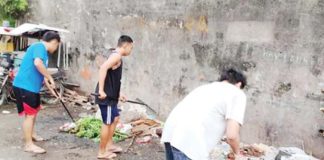 Residents clean their surroundings for dengue prevention. The Iloilo Provincial Health Office earlier sought a sustained cleanup campaign to combat dengue in the province. PHOTO COURTESY OF PNA