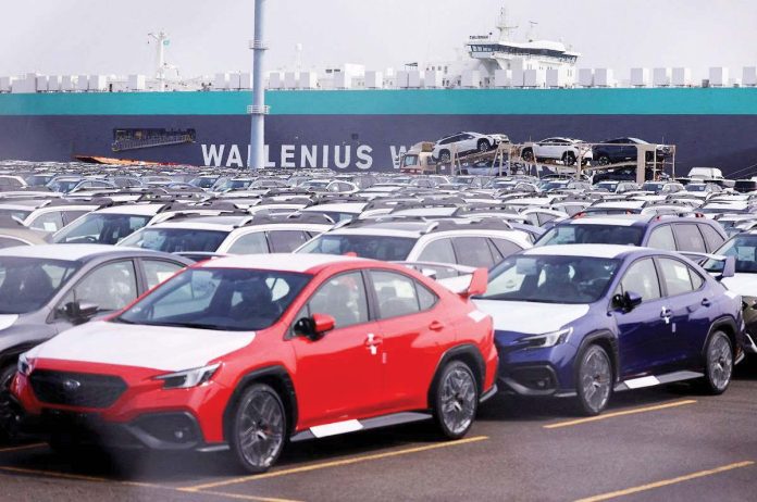 factories_1_resized Newly manufactured cars of an automobile maker awaiting export are parked at a port in Yokohama, south of Tokyo, Japan March 27, 2025. REUTERS/ ISSEI KATO/ FILE PHOTO
