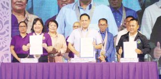 Gov. Arthur Defensor Jr. (center), Central Philippine University - College of Law Dean Atty. Aila Rae Endonila (left), and Iloilo Schools Division of Iloilo Superintendent Ernesto Servillon Jr. (right) proudly hold up the signed memorandum of agreement for the alaLAYI: Pag-ubay Legal sa Kabataan program during its official launch at the Iloilo Provincial Capitol lobby on Tuesday, April 8. The initiative, part of the 124th Semana sang Iloilo celebration, aims to deliver legal aid and education to teen centers across the province. AJ PALCULLO/PN