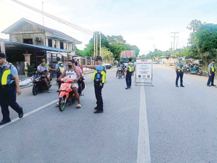 sara_police_pic_resized Police officers from the Sara Municipal Police Station stop motorists at a Commission on Elections (Comelec) checkpoint in Barangay Aspera, Sara, Iloilo. This checkpoint is part of heightened security measures as the Comelec identifies eight towns in Iloilo Province as “areas of concern” for the May 12 elections. SARA MPS PHOTO