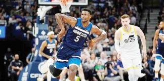 Minnesota Timberwolves guard Anthony Edwards (5) gestures after making a three-point shot during their game against the Utah Jazz. AP PHOTO/ABBIE PARR
