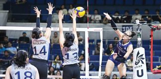 Adamson University Lady Falcons’ Shaina Nitura scores against the defense of Guimarasnon Camille Lamina of National University Lady Bulldogs. UAAP PHOTO