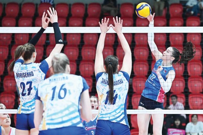 sports_AVC_resized Creamline Cool Smashers’ Erica Staunton tries to score against the defense of Zhetysu Volleyball Club. AVC PHOTO
