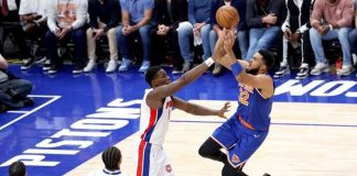 New York Knicks' Karl-Anthony Towns goes for a tough basket against the defense of Detroit Pistons' Paul Reed. PHOTO COURTESY OF NEW YORK POST
