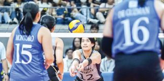 National University Lady Bulldogs’ Alyssa Solomon digs the ball from Ateneo de Manila University Blue Eagles. UAAP PHOTO