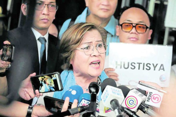De_Lima_1_resized Former senator Leila de Lima talks to reporters outside the Muntinlupa City Hall of Justice in Muntinlupa City in this June 24, 2024 file photo after the court cleared her of the third and last charge of conspiracy to commit drug trading. INQUIRER PHOTO/GRIG C. MONTEGRANDE