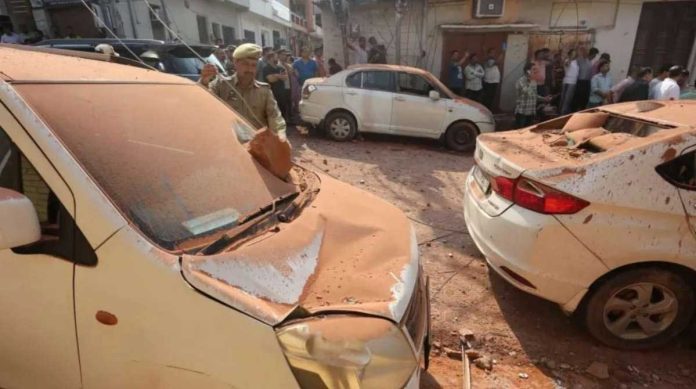 India_resized People gather around damaged vehicles and houses after shelling, at Jammu town in Indian-administered Kashmir. EPA