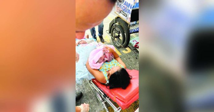 Mother gives birth_superimposed The safety officer of the Bacolod City’s Office of Building Administrator assisted the emergency delivery of a mother at the parking lot of the Bacolod City Government Center on Monday morning, May 5, 2025. BACOLOD CITY PIO PHOTO