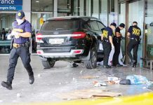 Investigators of the Scene of the Crime Operatives inspect the area where a car rammed into a section of the departure area of Ninoy Aquino International Airport Terminal 1, killing a girl and a 29-year-old man. GRIG C. MONTEGRANDE, PHILIPPINE DAILY INQUIRER
