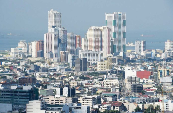 PH_growth_resized Global uncertainties spawned by the tariff war mounted by US President Donald Trump is expected to cap the Philippines’ economic growth this year. PHOTO BY TED ALJIBE / AFP
