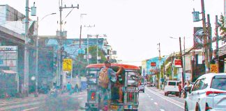 A passenger jeep emits black smoke as it traverses E. Rodriguez Sr. Avenue, Quezon City. According to the Department of Transportation, all drivers of public utility vehicles will now be required to undergo mandatory drug testing. PNA