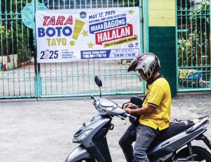 Palace_1_resized A rider stops in front of the Pinyahan Elementary School in Quezon City on Saturday, May 10, a polling place for the May 12 midterm elections. The vulnerable sector (elderly, pregnant, persons with disabilities and at least one companion) have exclusive voting hours from 5 a.m. to 7 a.m. Regular voters may vote from 7 a.m. to 7 p.m. PNA