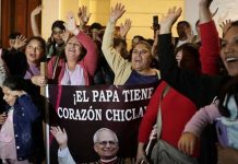 People celebrate at the Cathedral of Saint Mary in Chiclayo, Peru with a banner saying Pople XIV has a Chiclayo heart. REUTERS