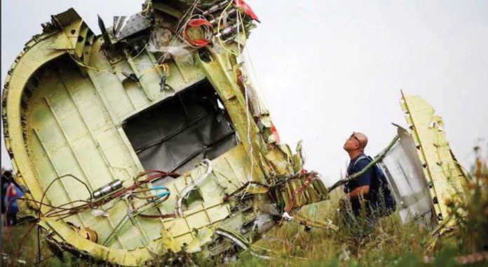 Russia_1_resized A Malaysian air crash investigator inspects the crash site of Malaysia Airlines Flight MH17 in the Donetsk region of Ukraine in July 2014. REUTERS