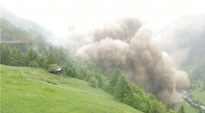 Thick clouds of dust from a glacier that collapsed threaten to cover this Swiss village. (BBC)