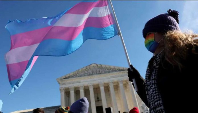 US A protester supporting transgender rights stand outside the US Supreme Court. GETTY IMAGES