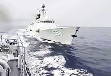 This screen grab handout photo taken on May 5, 2025 and received from the Armed Forces of the Philippines Public Affairs Office (AFP-PAO) shows Chinese frigate BN 554n (R) tailing Philippine Navy’s BRP Emilio Jacinto during a maritime patrol near Scarborough Shoal in the West Philippine Sea. Agence France-Presse