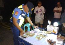 Authorities collared a 56-year-old man (second from left) involved in alleged vote-buying activities in Madalag, Aklan on Sunday night, May 11, 2025. PRO6 PHOTO
