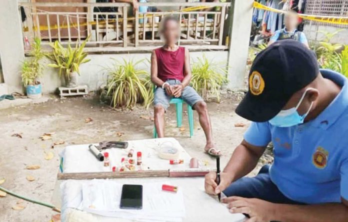 Alias “Erning”, a resident of Barangay Lisub-B, Anini-y, Antique, was arrested for possession of unlicensed firearms and live rounds of ammunition on May 9, 2025. PHOTO COURTESY OF PRO-6