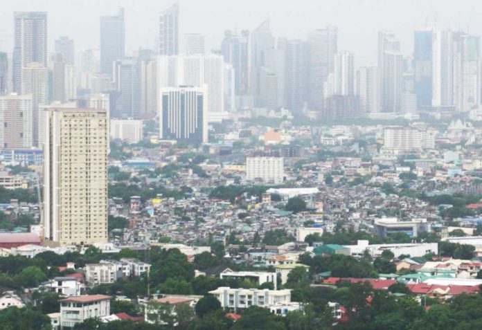 attracting-firms-1 The lower tariffs that the United States imposed on the Philippines plus its attractive demographics are seen sending the “right signals to global investors”. PHOTO BY TED ALJIBE / AFP