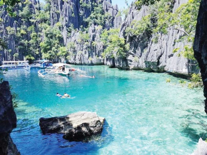 digital_nomad_destination_resized The Philippines aims to attract “respectful tourists” who contribute positively to local communities through sustainable tourism practices, according to the Department of Tourism. Photo shows the Twin Lagoon in Coron, Palawan. PHOTO COURTESY OF JOHN MICHAEL HUBAG