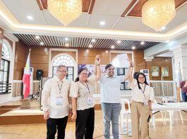 Officers of the Commission on Elections-Capiz officially proclaim Howard Guintu (second from right) as the elected representative of the province’s 1st District on May 13, 2025. PHOTO COURTESY OF BOMBO RADYO ROXAS