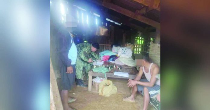 guns grenade_superimposed Two unlicensed firearms, ammunition and grenade were seized from alias “Sammy” (right) when police raided his house in Sitio Magalan, Barangay Sagrada Familia, Dumarao, Capiz. DYVR ROXAS PHOTO