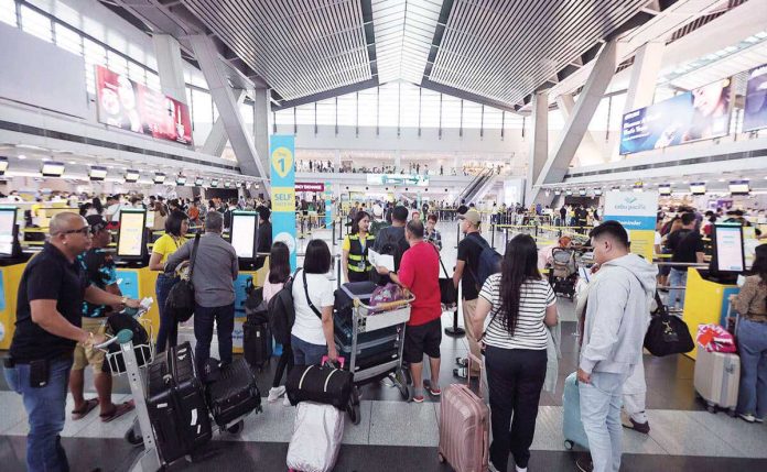 Airfares may go down in June following the advisory of the Civil Aeronautics Board that fuel surcharge is dropping to Level 3 next month. INQUIRER FILE PHOTO
