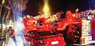 A red sedan blocks access to a fire hydrant at Molo Plaza, Iloilo City as firefighters from Federation Fire Iloilo scramble to connect hoses during an emergency response — prompting outrage from volunteers and renewed calls for stricter enforcement against illegal parking. FEDERATION FIRE ILOILO PHOTO