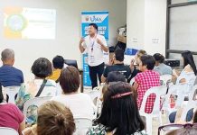 A resource speaker discusses service quality with market vendors during a training session of the Uswag Negosyo Academy at the Local Economic Development and Investment Promotion Office, Iloilo City Hall. The program aims to equip vendors with business skills and grant them additional capital upon completion.
