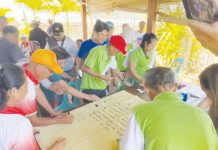 Barangay leaders from Tambaliza, Talotoan, and Macatunao in Pan de Azucar Island sign a pledge of commitment during a consultative meeting held on May 5, 2025, in Barangay Tambaliza, Concepcion, Iloilo. The activity forms part of the Iloilo Provincial Government’s efforts to unify local stakeholders in support of the proposed declaration of Pan de Azucar Island as an eco-tourism destination. SCREEN GRAB/SCREENSHOT FROM BALITA HALIN SA KAPITOLYO
