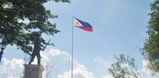 The Philippine flag is seen fluttering at the historic public plaza of Santa Barbara, Iloilo near the statue of Ilonggo hero Gen. Martin Delgado. The public plaza of Santa Barbara was where Delgado first raised the Philippine flag outside Luzon on November 17, 1898 — an event known as the Cry of Santa Barbara. This marked the formal inauguration of the revolutionary government in the Visayas and symbolized the region’s commitment to the cause of Philippine independence from Spain. PN FILE