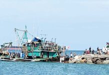 Authorities escort the seized F/B Seahorse, a fishing vessel caught using the banned Danish Seine method off Bantigui Island, Carles, Iloilo. The operation forms part of the Iloilo Provincial Government’s intensified crackdown on illegal, unreported, and unregulated (IUU) fishing. CAPITOL PHOTO
