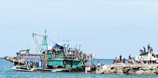 Authorities escort the seized F/B Seahorse, a fishing vessel caught using the banned Danish Seine method off Bantigui Island, Carles, Iloilo. The operation forms part of the Iloilo Provincial Government’s intensified crackdown on illegal, unreported, and unregulated (IUU) fishing. CAPITOL PHOTO