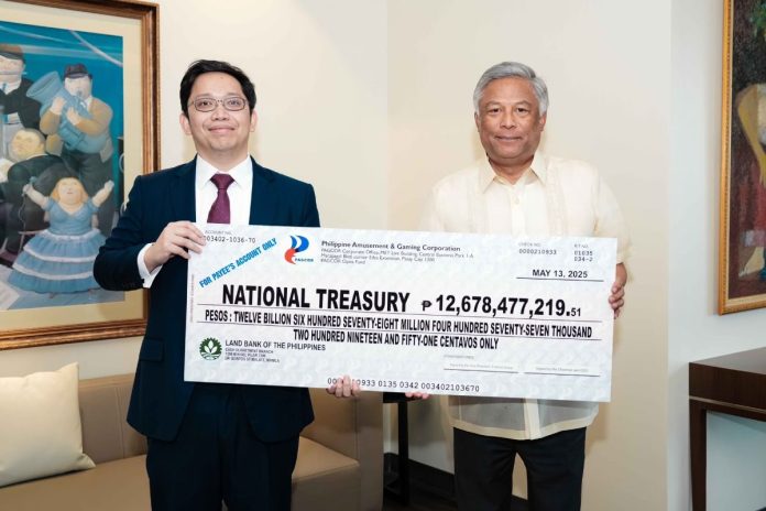 photo-PAGCOR remits Php12.67 billion in cash dividends to the National Treasury (1) PAGCOR Chairman and CEO Alejandro H. Tengco (right) hands over to Deputy National Treasurer Eduardo Anthony Mariño a facsimile check representing the state gaming firm’s dividend contribution for 2024 during a simple ceremony at the PAGCOR Executive Office in Pasay City on May 14.