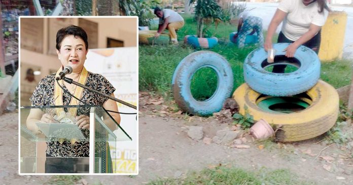 quinon Dr. Maria Socorro Colmenares-Quiñon (inset), chief of the Iloilo Provincial Health Office, says community cooperation is still the strongest weapon against dengue. Photo shows barangay health workers of Anilao town getting rid of possible breeding sites of mosquitoes such as old tires during the “Limpyo Iloilo, Kada Lunes nga Lihok Kontra Lamok” on April 12, 2025. BARANGAY HEALTH WORKERS ANILAO/FB PHOTO