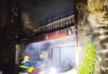 Firefighters help extinguish the fire that hit a house on Thursday night, May 8, 2025, in Barangay Baybay, Roxas City. BASKOG RADYO/FACEBOOK PHOTO