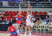 Barangay Ginebra San Miguel Kings’ Benedict Adamos pulls up for a shot against the defense of Phoenix Fuel Masters’ Jason Perkins. PBA PHOTO